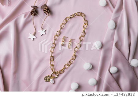 Women's Jewelry. Trendy jewelry on silk background. Flat lay, top view. 124452938