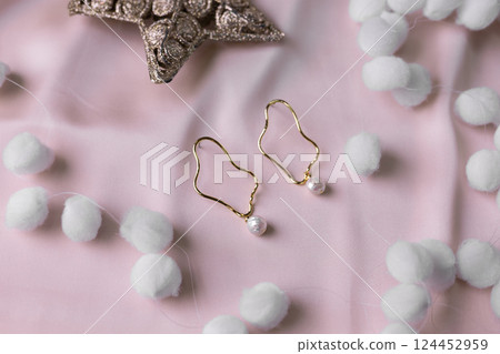 Women's Jewelry. Trendy jewelry on silk background. Flat lay, top view. 124452959