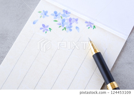 Image of writing a letter on a notepad 124453109