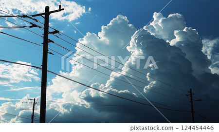 Memories of Midsummer - Thunderclouds and the silhouette of a utility pole 124454446