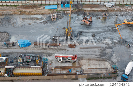 Top view of construction with cranes and excavators and heavy equipment 124454841