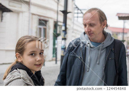Happy family together. Young girl daughter and her father portrait 124454848