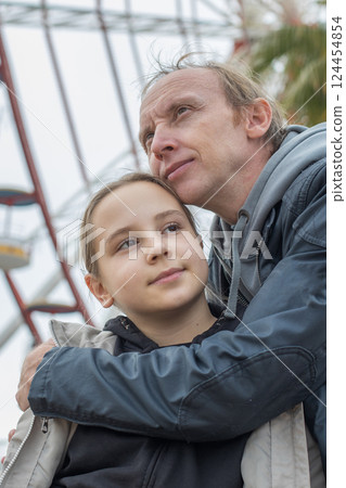 Happy family together. Young girl daughter and her father portrait 124454854