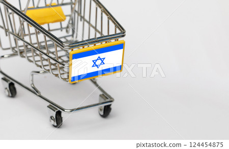 Shopping, VAT and retail in Israel concept. Shopping Cart with Israeli flag on white background Shopping, VAT and retail in Israel concept. Shopping Cart with Israeli flag on white background 124454875