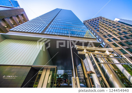 Tokyo cityscape in Japan, with a view of Toranomon-Kotohira Tower and Kotohira Shrine. (Toranomon Hills Station is in the background on the left side of the screen.) 124454940