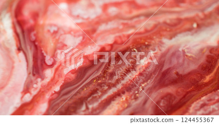 Sparkling fluid. Marble art. Defocused red crimson pink color shimmer paint in water liquid blend spilling on abstract bokeh background. Sparkling fluid. Marble art. Defocused red crimson pink color shimmer paint in water liquid blend spilling on abstract bokeh background. 124455367