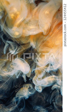 Art cloud. Shimmering mist. Golden yellow paint spill swirl abstract background. Fume color dye water shiny emulsion defocused steam. 124455412