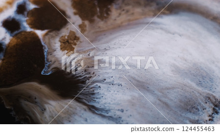 Ink wave. Fluid spill. Defocused brown white color paint chemical marble particles stains in liquid floating on abstract background. Ink wave. Fluid spill. Defocused brown white color paint chemical marble particles stains in liquid floating on abstract background. 124455463