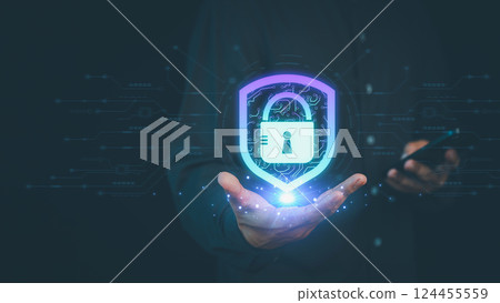 Business person holds a glowing digital shield with a lock symbol, representing cybersecurity, data protection, privacy, and secure technology against online threats. Business person holds a glowing digital shield with a lock symbol, representing cybersecurity, data protection, privacy, and secure technology against online threats. 124455559