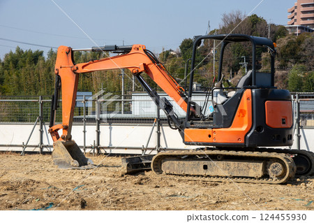 Hydraulic excavator at construction site 124455930