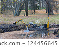 Dredger for cleaning reservoirs in the autumn park. Method of cleaning a reservoir. Preparing the park for the tourist season. Working platform for cleaning river beds and reservoir bottoms. 124456645