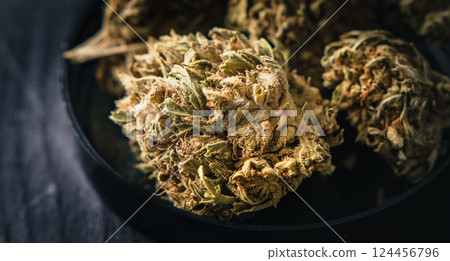 Dry CBD cannabis as dried hemp flowers 124456796
