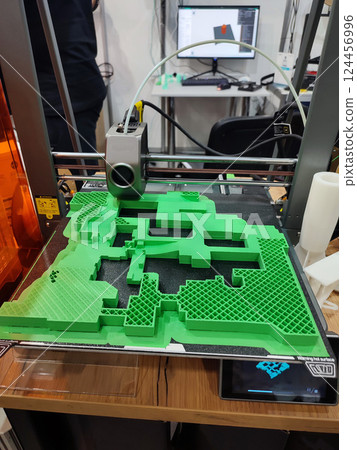3D printer printing object close-up. Process creating three-dimensional model on 3d printer. Additive printer technology. 3D Prototyping. 3D design modeling. New modern innovation printing technology 3D printer printing object close-up. Process creating three-dimensional model on 3d printer. Additive printer technology. 3D Prototyping. 3D design modeling. New modern innovation printing technology 124456996
