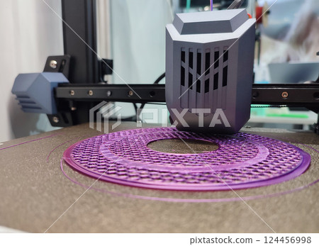 3D printer printing object close-up. Process creating three-dimensional model on 3d printer. Additive printer technology. 3D Prototyping. 3D design modeling. New modern innovation printing technology 124456998