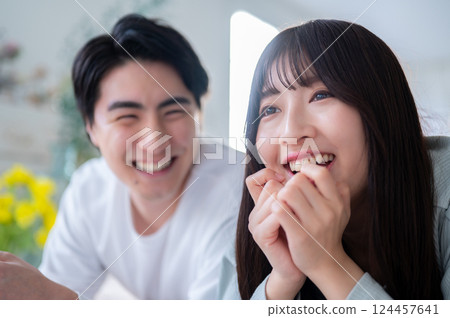 Smiling men and women standing side by side Smiling men and women standing side by side 124457641