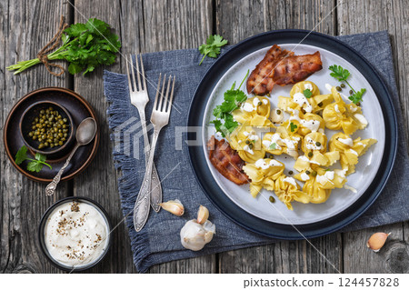 sacchettoni, pasta with bacon and cheese filling 124457828