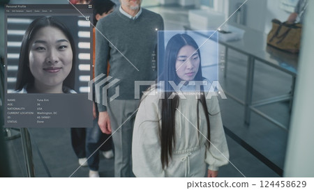 Diverse Passengers Passing Biometric AI Face Scanning at Border Control for Boarding Flight Diverse Passengers Passing Biometric AI Face Scanning at Border Control for Boarding Flight 124458629