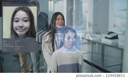 Queue of Diverse People Passing Biometric AI Face Identification at Border Control in Airport Terminal Queue of Diverse People Passing Biometric AI Face Identification at Border Control in Airport Terminal 124458651