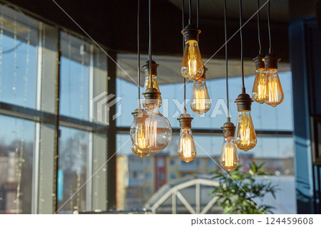 Decorative ceiling light bulbs shine with a dim light. Home decoration and interior elements Decorative ceiling light bulbs shine with a dim light. Home decoration and interior elements 124459608