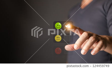 A man touches the icon on the happy smile face to indicate satisfaction with the service. Feedback, survey, and review concept. Rating: Very impressed. A man touches the icon on the happy smile face to indicate satisfaction with the service. Feedback, survey, and review concept. Rating: Very impressed. 124459749
