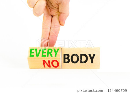 Everybody vs nobody symbol. Concept words Everybody and Nobody on wooden cubes. Beautiful white table white background. Businessman hand. Business and everybody vs nobody concept. Copy space. Everybody vs nobody symbol. Concept words Everybody and Nobody on wooden cubes. Beautiful white table white background. Businessman hand. Business and everybody vs nobody concept. Copy space. 124460709