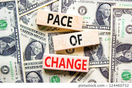 Pace of change symbol. Concept words Pace of change on beautiful wooden blocks. Dollar bills. Beautiful background from dollar bills. Business pace of change concept. Copy space. 124460732
