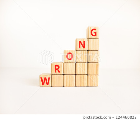 Wrong symbol. Concept word Wrong on beautiful wooden blocks. Beautiful white table white background. Business lifestyle wrong concept. Copy space. 124460822