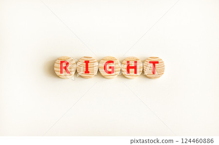 Right symbol. Concept word Right on beautiful wooden circles. Beautiful white table white background. Business lifestyle right concept. Copy space. Right symbol. Concept word Right on beautiful wooden circles. Beautiful white table white background. Business lifestyle right concept. Copy space. 124460886