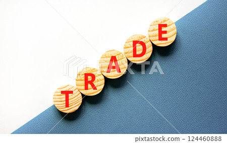 Trade symbol. Concept word Trade on beautiful wooden circles. Beautiful white and blue background. Business lifestyle trade concept. Copy space. 124460888