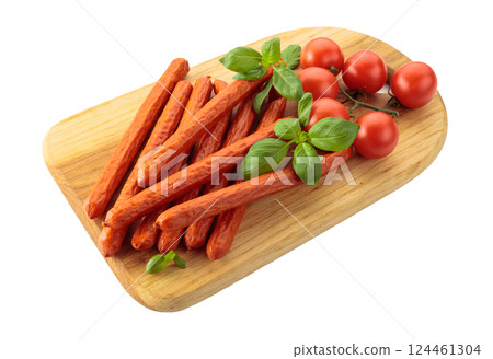 Kabanos sausages with basil and tomatoes isolated on a white background. Kabanos sausages with basil and tomatoes isolated on a white background. 124461304