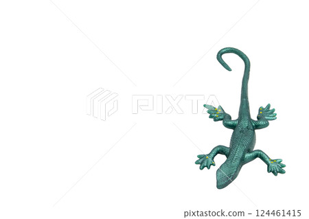 Green rubber lizard toy, top view, no background. Playful and fun, perfect for children's designs, educational materials or toy store advertising. 124461415