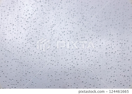 Water Droplets Scattered Across Glass Creating an Abstract Pattern Water Droplets Scattered Across Glass Creating an Abstract Pattern 124461665