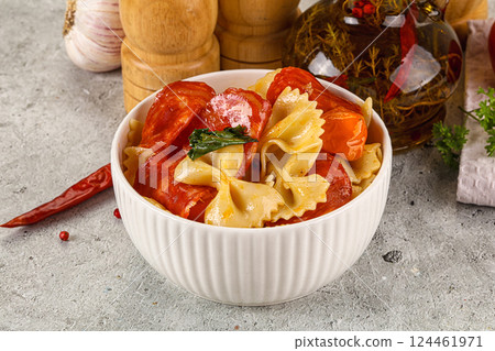 Italian pasta farfalle with pepperoni Italian pasta farfalle with pepperoni 124461971