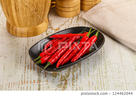 Red hot chili pepper heap 124462044