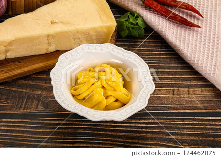 Yellow cheese sauce in the bowl Yellow cheese sauce in the bowl 124462075