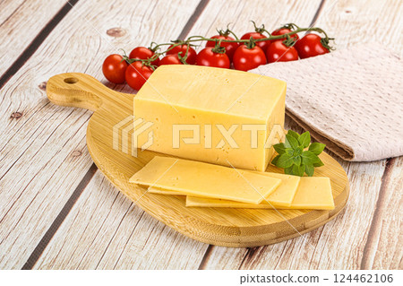 Yellow cheese piece with slices 124462106