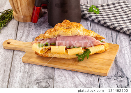 Fresh croissant with ham and cheese 124462300