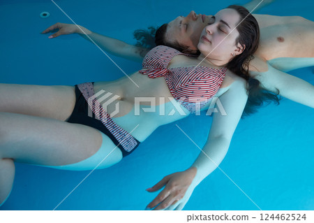 Couple in love in a therapeutic spa pool relaxing in the salty sea water 124462524