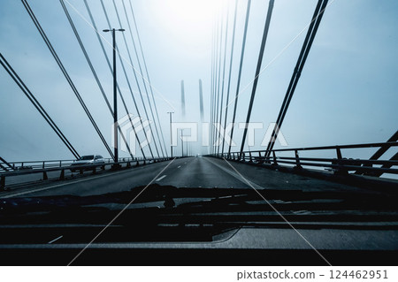 High-speed road bridge view from a fast-moving car. 124462951