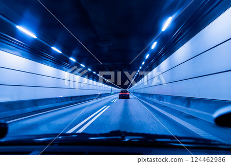 High-speed road tunnel view from a fast-moving car. High-speed road tunnel view from a fast-moving car. 124462986