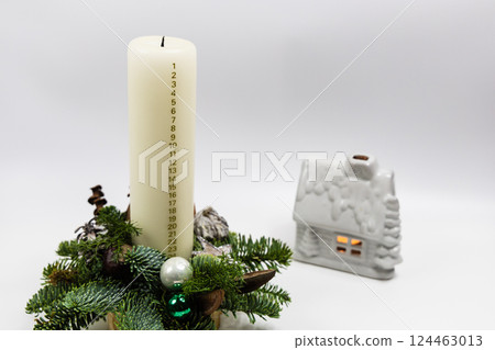 Christmas advent candle whith numbers. Christmas decor and holiday preparations 124463013