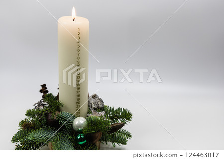 Christmas advent candle whith numbers. Christmas decor and holiday preparations 124463017