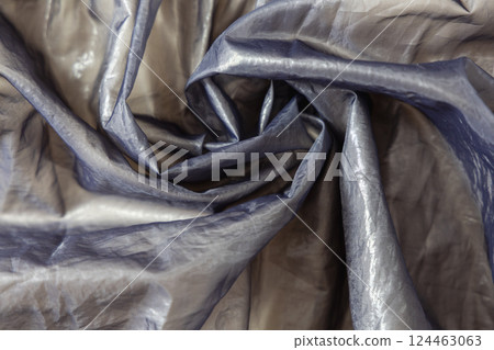 Beautiful textile background metallic shiny silk texture. 124463063