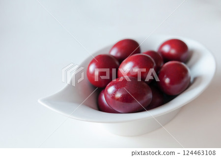Traditional red easter eggs. Chicken eggs are painted red Traditional red easter eggs. Chicken eggs are painted red 124463108