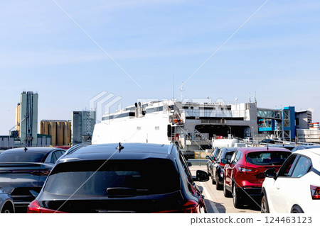 Seaport and terminal for passenger ferry transport in the city of Ystad. Line of cars waiting to board the ferry. 124463123