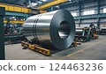 Industrial background. Big size steel coil stored inside industrial warehouse 124463236