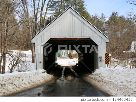 Looking Through a Covered Bridge in Winter Landscape With Snow and Clear Blue Sky Looking Through a Covered Bridge in Winter Landscape With Snow and Clear Blue Sky 124463433