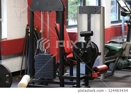Neatly Arranged Weighttlifing Equipment in a Gym 124463434