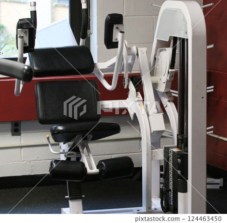 Exercise Equipment in a Gym Ready for Workout Sessions 124463450