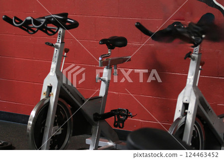 Indoor Cycling Bikes Ready for Workout in Fitness Studio 124463452